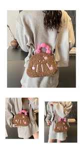 Close-up of the plush brown lambskin fabric texture and pink cherry embroidery details