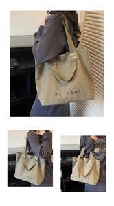 Detailed view of a khaki canvas tote bag featuring large Inside Out text and crossbody straps