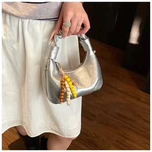 Silver pleated croissant bag with colorful creative bead charm and metallic finish
