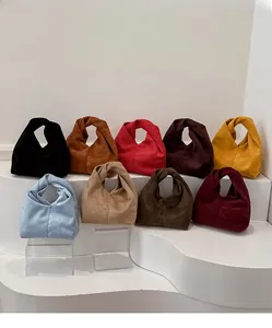 Minimalist faux suede cloud bag collection featuring nine colors and soft knotted handles