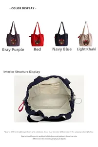 Detail view of embroidered canvas tote bag showing drawstring closure and inner zip pocket