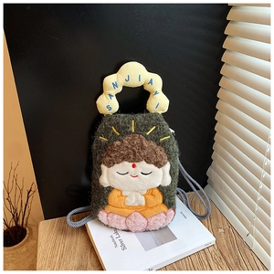 Detailed close-up of cartoon Buddha plush crossbody bag with delicate embroidery