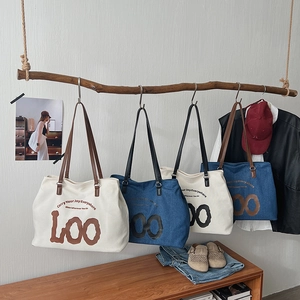 Large canvas and denim tote bags with slogans for school and daily commute use