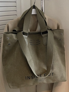 Army green large canvas tote bag with shoulder straps and reinforced metal rivets