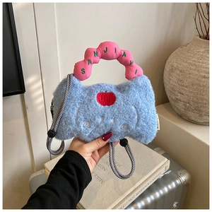 Close-up of sky blue plush handbag with heart embroidery and pink wavy handle details