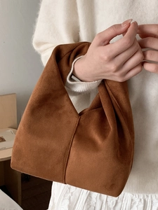 Minimalist brown suede cloud bag with twisted handle for casual autumn winter commute