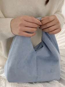 Minimalist sky blue ruched cloud handbag in soft suede material with triangular structure