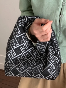 Ethnic retro handbag with silver geometric embroidery and braided handle in black fabric