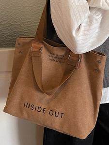 Brown large capacity canvas tote bag with INSIDE OUT print and reinforced shoulder straps