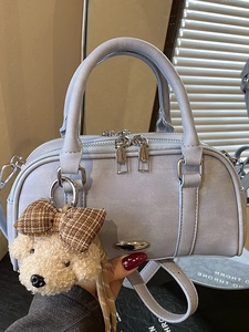 Light purple Boston handbag in matte leather with a cute plush puppy pendant charm