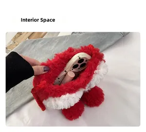 Detail showing the spacious plush red handbag interior with space for phone and lipstick