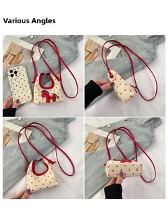 Multiple views of a small cream canvas crossbody bag with red polka dots and horse patch