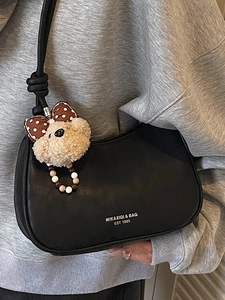 Vintage black faux leather crescent shoulder bag with cute brown plush bear charm