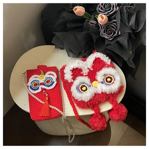 Detail of red lion dance crochet phone bag and plush crossbody with festive tassel