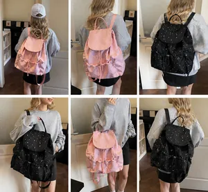 Detailed views of Korean retro polka dot backpack in pink and black on a model