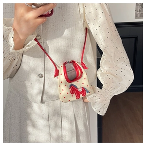 Mini beige canvas crossbody bag with red polka dots and horse embroidery detail