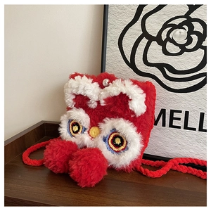 Detail of red plush lion dance cross-body bag with pearl clasp and woven strap