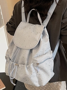 Chic light blue drawstring backpack with silver star patterns and flap closure for women