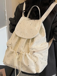 Retro cream canvas backpack with silver star print and drawstring flap closure