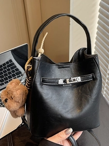 Vintage black PU leather bucket bag with silver lock and a cute bear keychain accessory