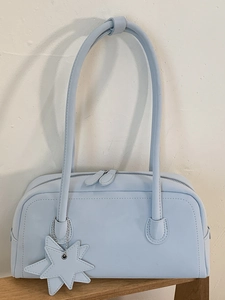 Minimalist light blue bowling style leather handbag with star charm and shoulder strap