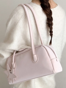 Pale pink leather bowling shoulder bag for women with a cute star-shaped charm accessory