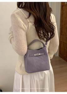 Rear view of purple retro bucket bag showing sophisticated minimalist style and proportions