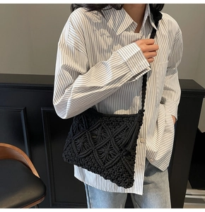 Detail of black handmade woven shoulder bag showing bohemian diamond mesh pattern