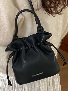 Fashionable black leather drawstring bucket bag with handle and shoulder strap