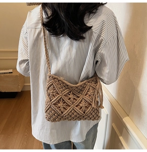 Detail shot of the khaki handmade woven cotton bag with tassels and diamond pattern