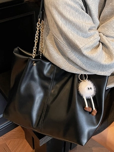 Vintage black faux leather tote bag with gold chain strap and cute plush charm