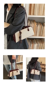 Three-view shot of burgundy leather and canvas boston bag with tassel detail
