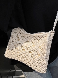 Handmade beige macrame crossbody bag with boho tassels and geometric woven pattern