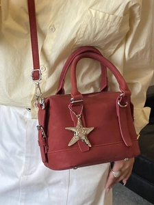 Red minimalist Boston handbag with star pendant and crossbody strap for women