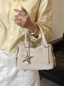 Elegant off-white pillow handbag with starfish charm and round handle for women