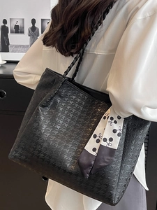 Fashionable black houndstooth tote bag for women with woven handle and silk scarf detail