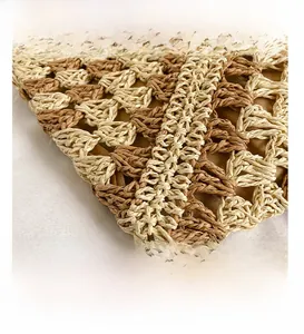 Close-up of the dual-color woven texture and inner lining on a straw tote bag