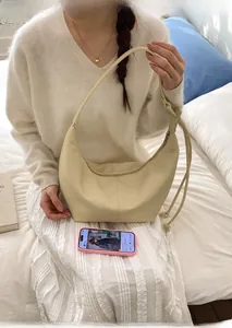 French style creamy crescent shoulder bag with soft leather pleats and side drawstring