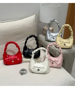 Detailed display of six colorful crescent moon bags with ribbon bows and heart charms