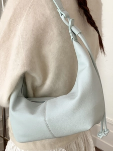 Minimalist light blue crescent shoulder bag made of soft lychee pattern vegan leather