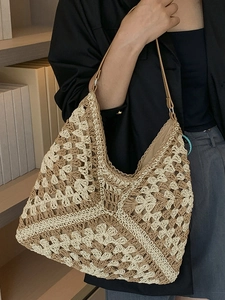 Large capacity woven straw hobo bag with two-tone floral pattern and leather shoulder strap
