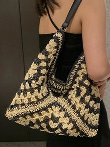 Large woven tote bag with geometric pattern and black leather strap for summer commute