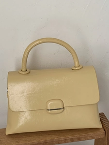 Minimalist cream leather square handbag for women with silver buckle and top handle