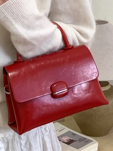 Elegant red patent leather square handbag with top handle and silver metal accents for women