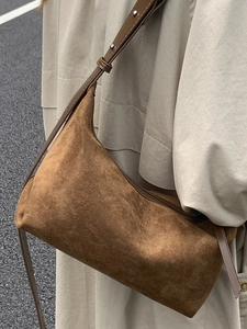 Brown suede hobo handbag with silver rivet studs for casual shoulder carry commute