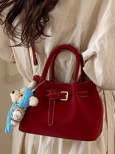 Vintage dark red bucket bag with matte texture, gold hardware and cute teddy bear charm