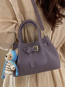 Retro purple matte bucket bag with gold buckle and a cute crochet bear charm pendant