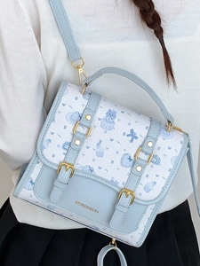 Preppy style handbag with cartoon cat patterns and light blue adjustable shoulder strap