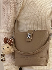 Brown litchi grain bucket bag with silver twist lock and cute plush bear charm