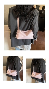 Detail of light pink shoulder bag featuring soft faux leather and stylish side strap ties